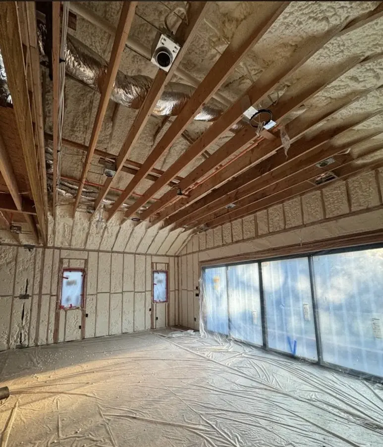 Interior walls and ceiling insulated with spray foam during new construction in Roscoe